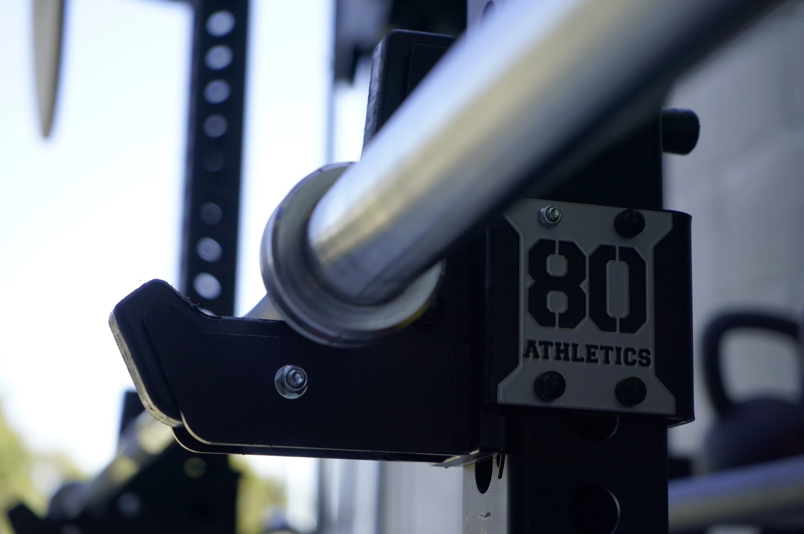 gym80 strength equipment detail — machined steel and branded hardware