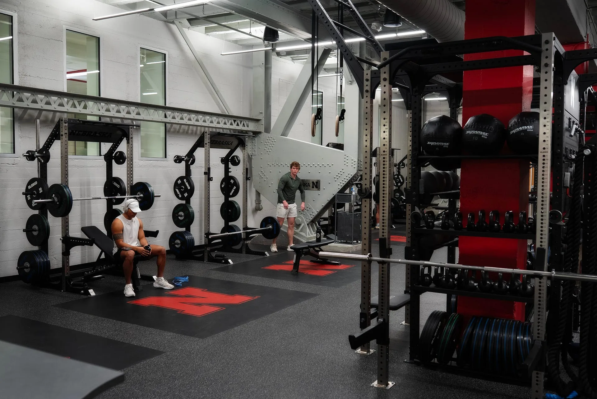 College recreation gym with fresh rubber flooring and strength equipment