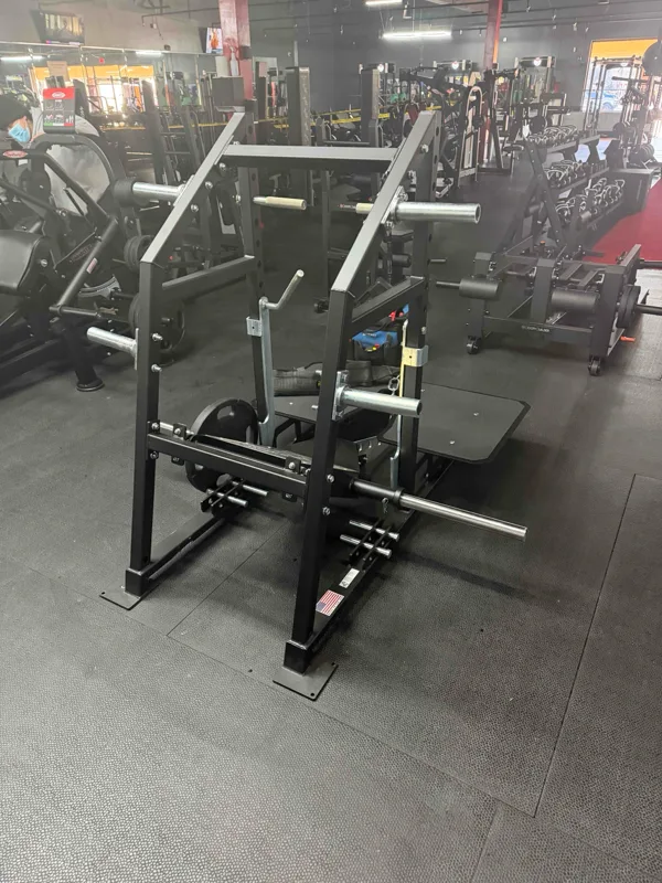 Wide view of a commercial gym floor with Rogue and Core strength equipment