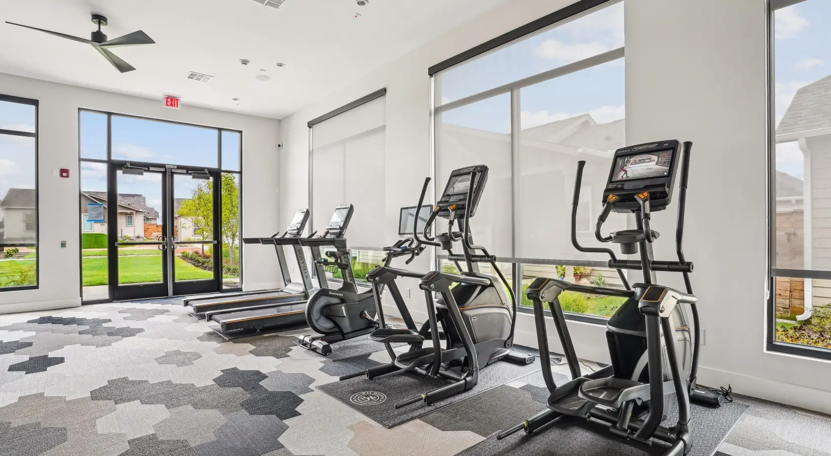 Matrix cardio row with Echelon bikes in a community fitness room