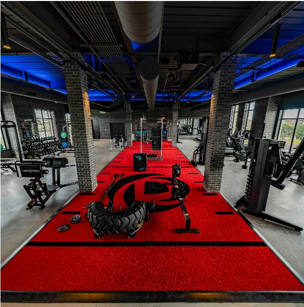 Custom logo inlay cut into commercial gym flooring